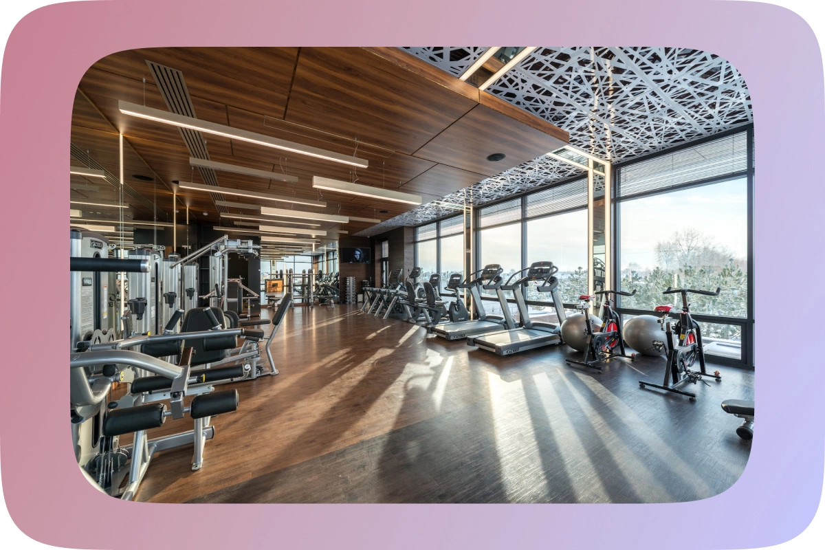 cardiovascular - Gym equipment such as treadmill, weight-lifting and bikes in a nice gym with a view
